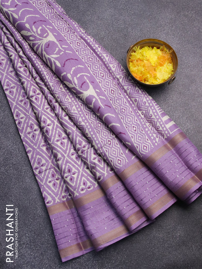 Semi dola saree lavender shade with allover prints and zari woven sequin work border