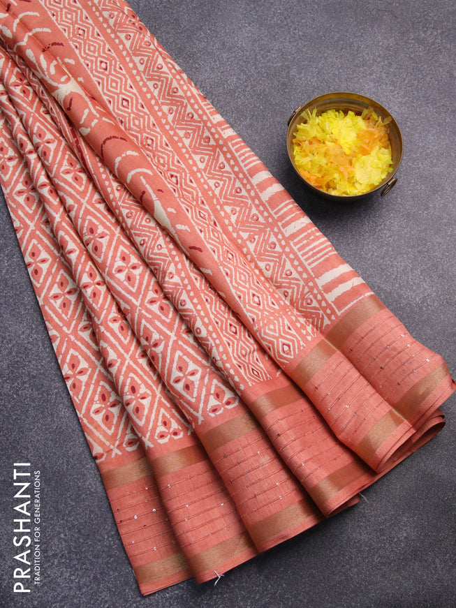 Semi dola saree peach orange with allover prints and zari woven sequin work border