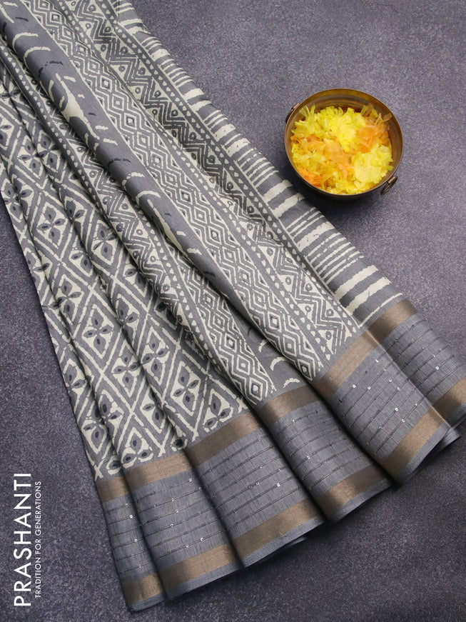 Semi dola saree grey shade with allover prints and zari woven sequin work border