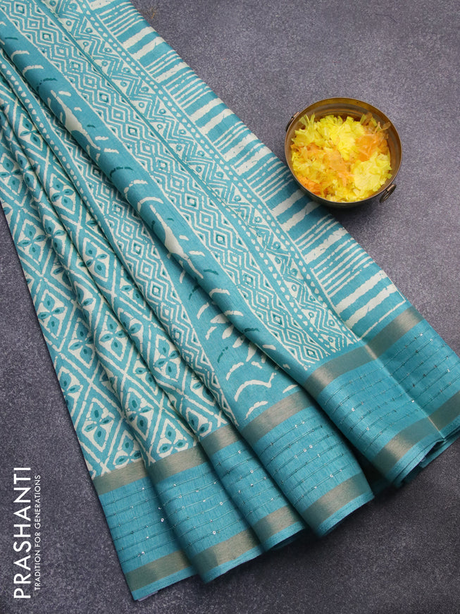 Semi dola saree teal blue with allover prints and zari woven sequin work border