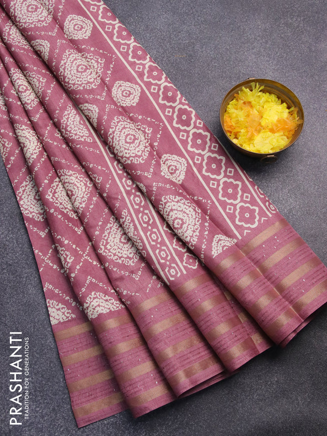 Semi dola saree mauve pink with allover prints and zari woven sequin work border