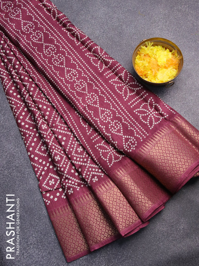 Semi dola saree wine shade with allover bandhani prints and zari woven border