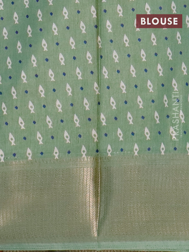 Semi dola saree pastel green with allover geometric prints and zari woven border