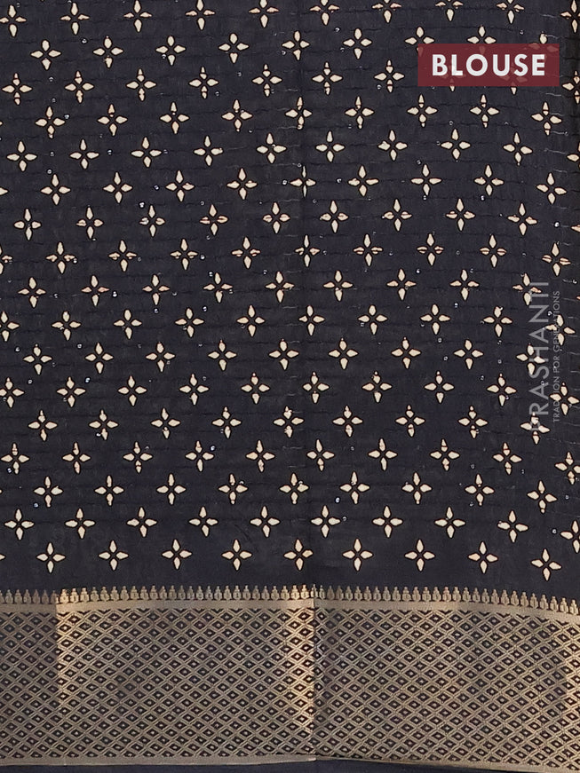 Semi dola saree black with allover prints & sequin work and zari woven border