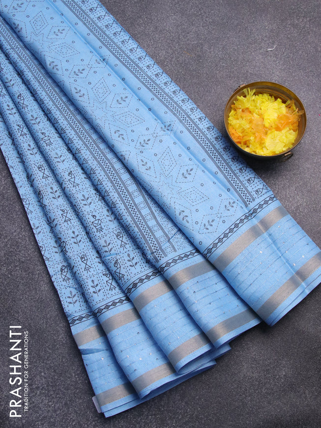 Semi dola saree light blue with allover warli prints and zari woven sequin work border