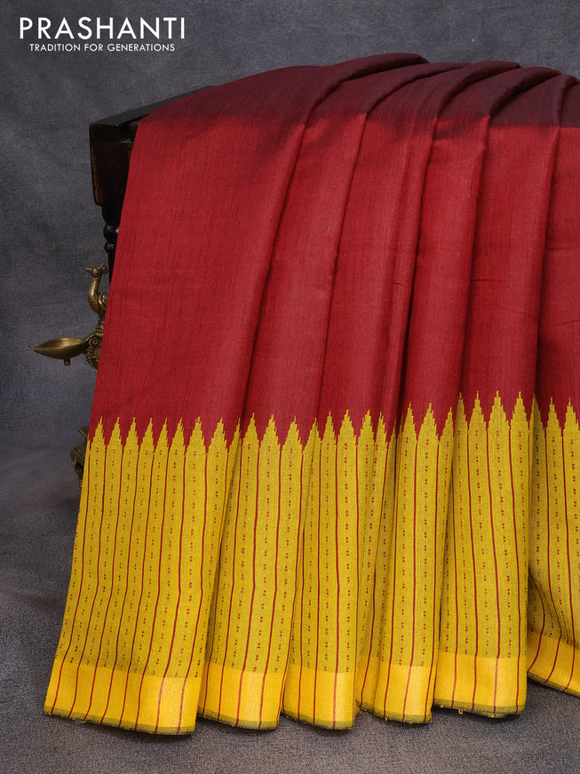 Dupion silk saree maroon and yellow with plain body and temple design thread woven border