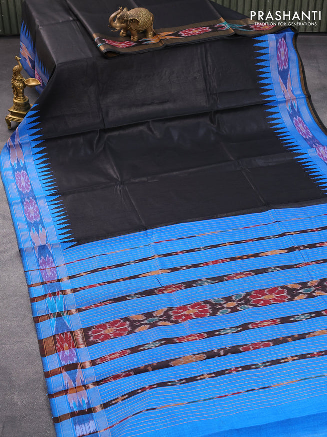 Dupion silk saree black and cs blue with plain body and temple design ikat woven border