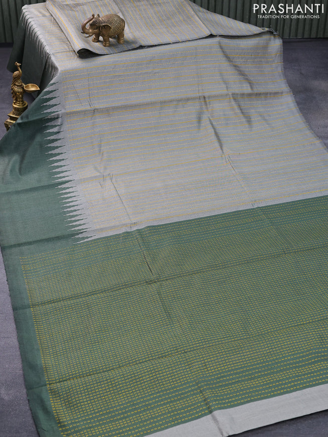 Dupion silk saree grey shade and sap green with allover thread stripe weaves and long temple woven border