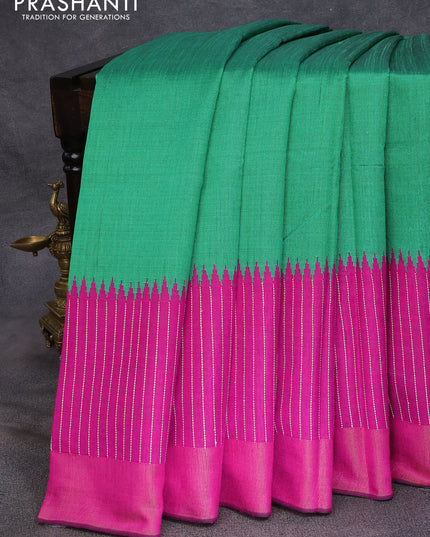 Dupion silk saree green and magenta pink with plain body and temple design thread woven zari border