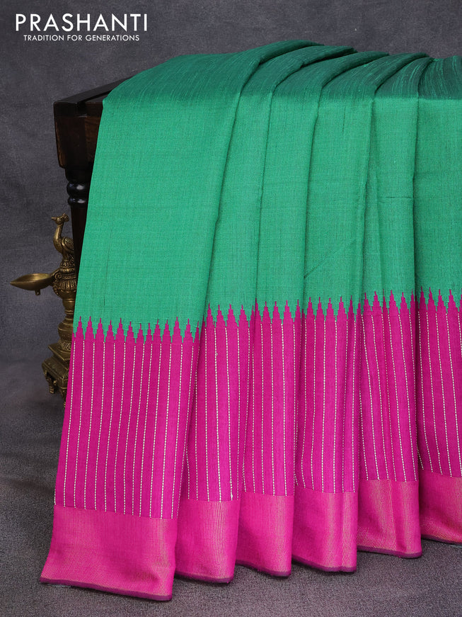 Dupion silk saree green and magenta pink with plain body and temple design thread woven zari border