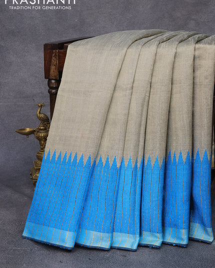 Dupion silk saree beige and cs blue with plain body and temple woven zari border