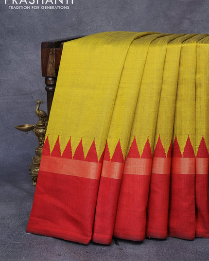 Dupion silk saree yellow and maroon with plain body and temple design zari woven simple border
