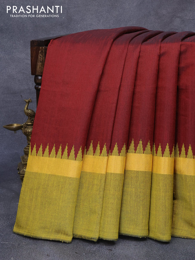 Dupion silk saree maroon and yellow with plain body and temple design zari woven simple border