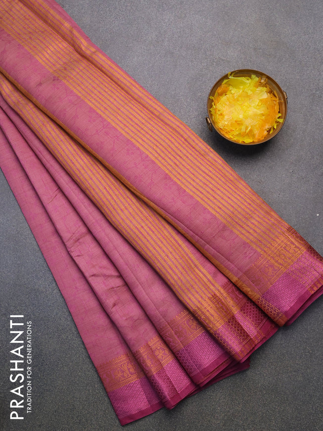 Semi raw silk saree purple with allover self emboss and copper zari woven simple border