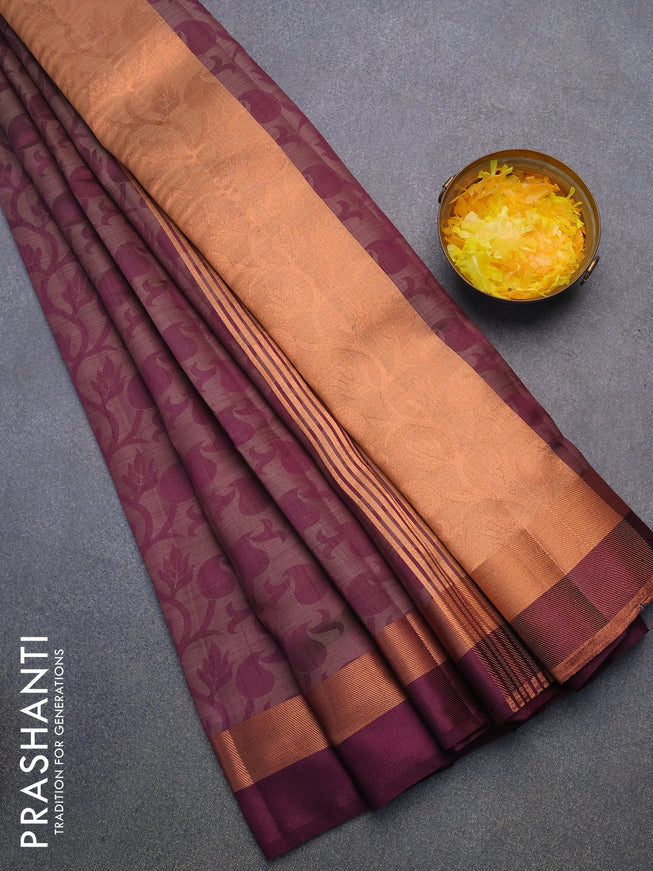 Semi raw silk saree wine shade with allover self emboss and copper zari woven simple border