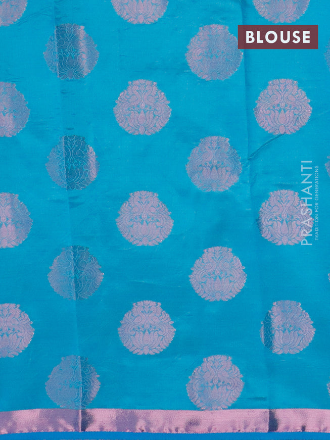 Semi raw silk saree cs blue with allover pink zari woven buttas and small pink zari woven border