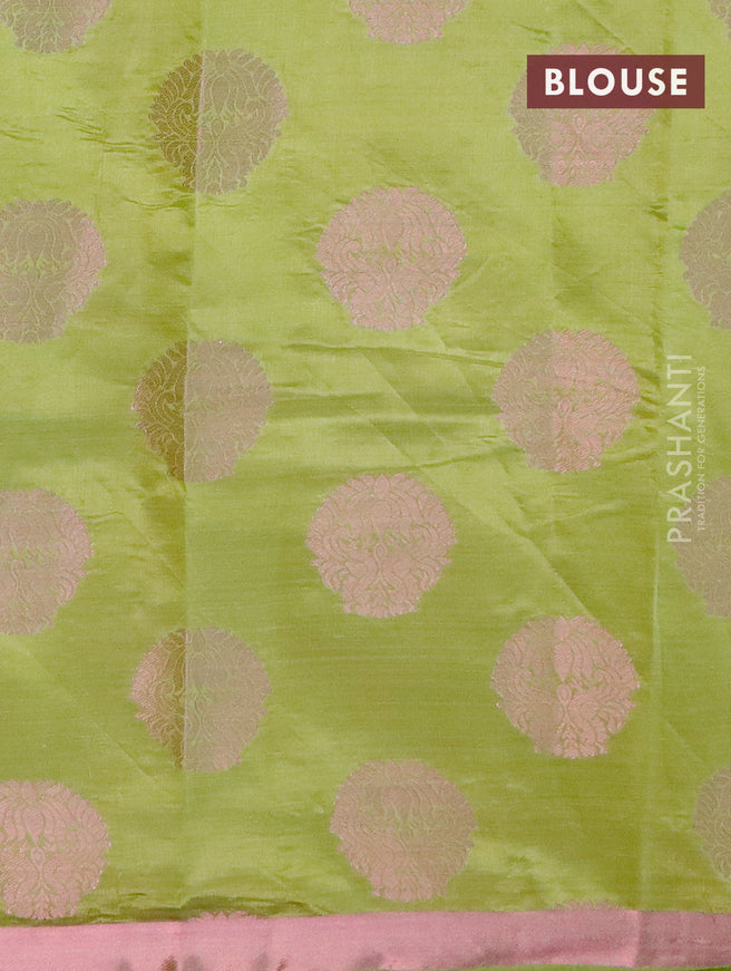 Semi raw silk saree light green with allover pink zari woven buttas and small pink zari woven border