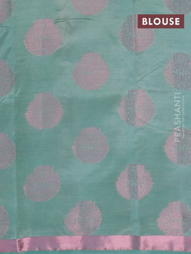 Semi raw silk saree pastel shade with allover pink zari woven buttas and small pink zari woven border