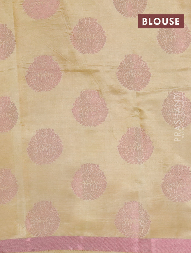 Semi raw silk saree sandal with allover pink zari woven buttas and small pink zari woven border