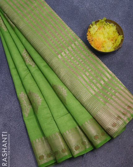 Semi raw silk saree green with floral zari woven buttas and zari woven border