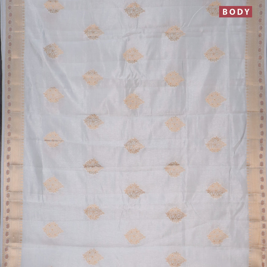 Semi raw silk saree pastel grey with floral zari woven buttas and zari woven border