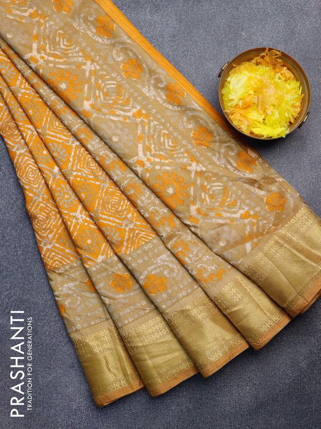 Semi tussar saree mustard yellow and dark sandal with allover batik weaves and zari woven border