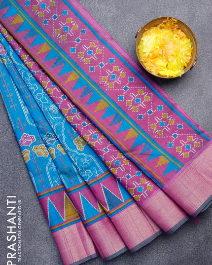 Semi tussar saree teal blue and purple with allover floral prints and zari woven border