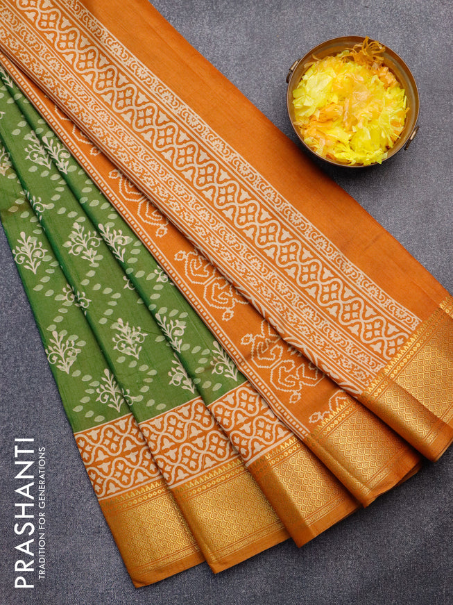 Semi tussar saree green shade and dark mustard with allover prints and zari woven border
