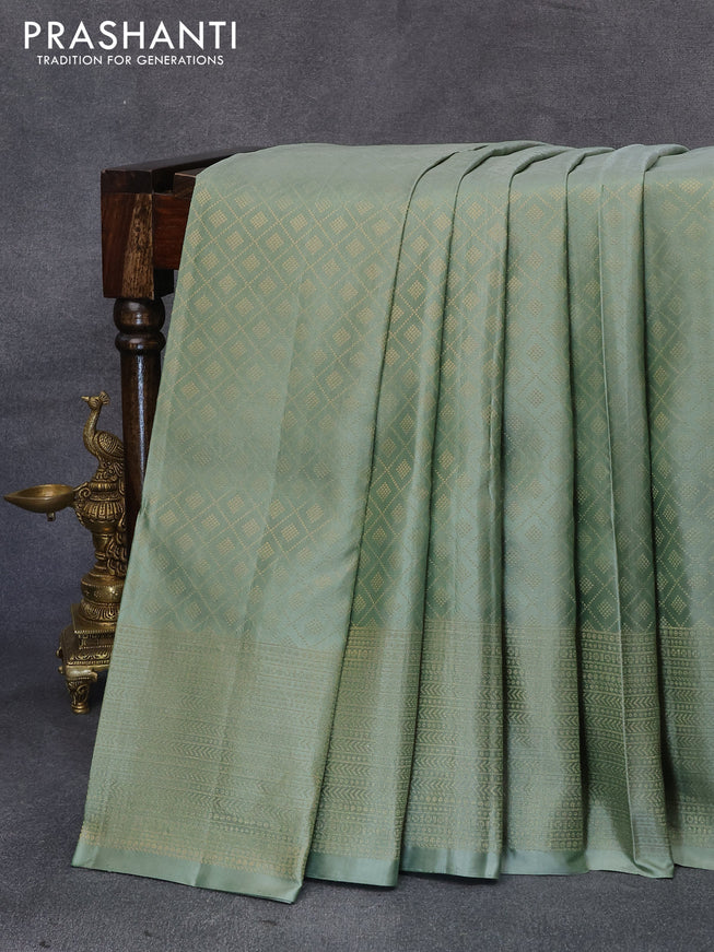Pure soft silk saree pastel green with allover zari weaves and zari woven border