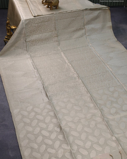 Pure soft silk saree beige with allover silver zari woven brocade weaves and long silver zari woven border