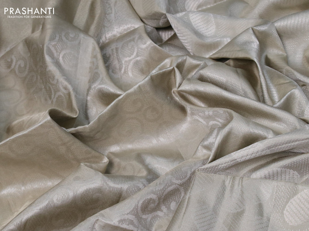Pure soft silk saree beige with allover silver zari woven brocade weaves and long silver zari woven border