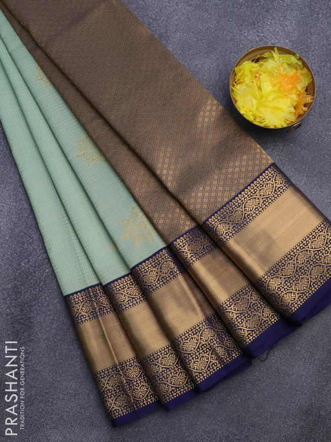 Semi kanjivaram silk saree pastel shade and navy blue with allover zari checks & buttas and long zari woven korvai border