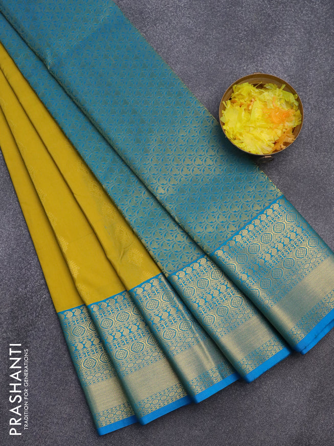 Semi kanjivaram silk saree lime yellow and blue with allover zari woven buttas and long zari woven korvai border