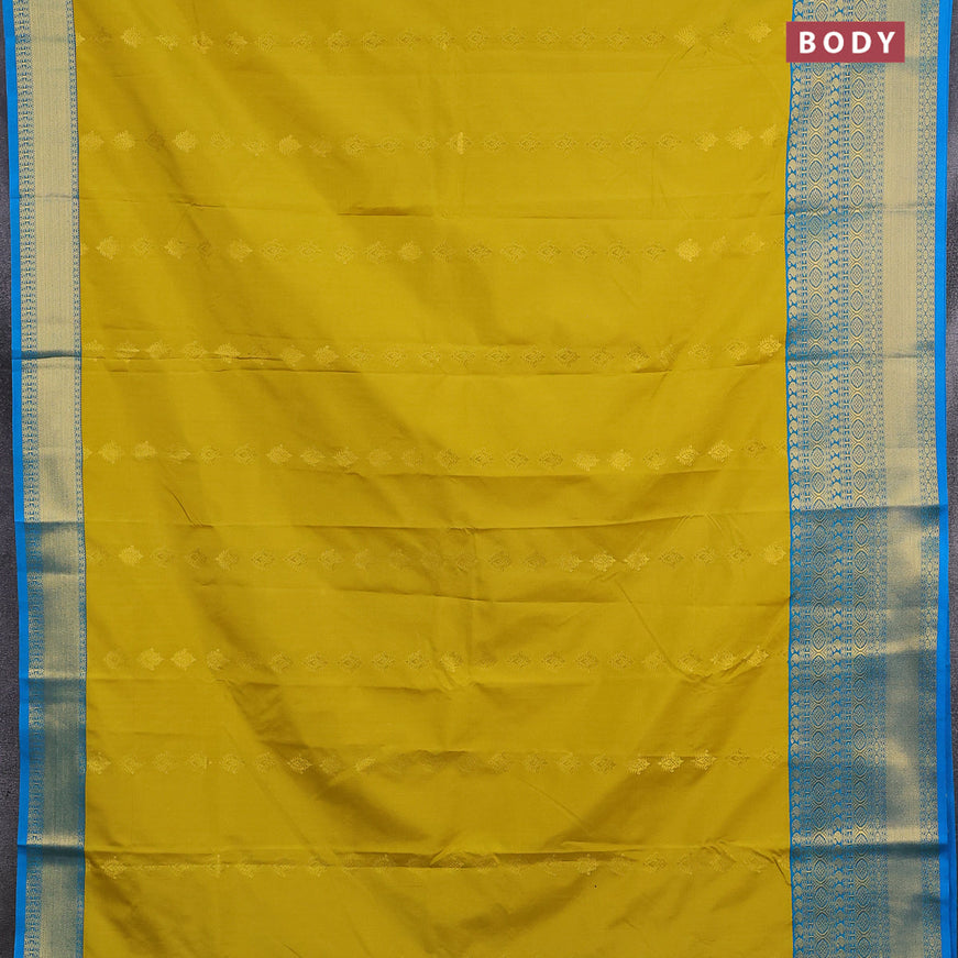 Semi kanjivaram silk saree lime yellow and blue with allover zari woven buttas and long zari woven korvai border