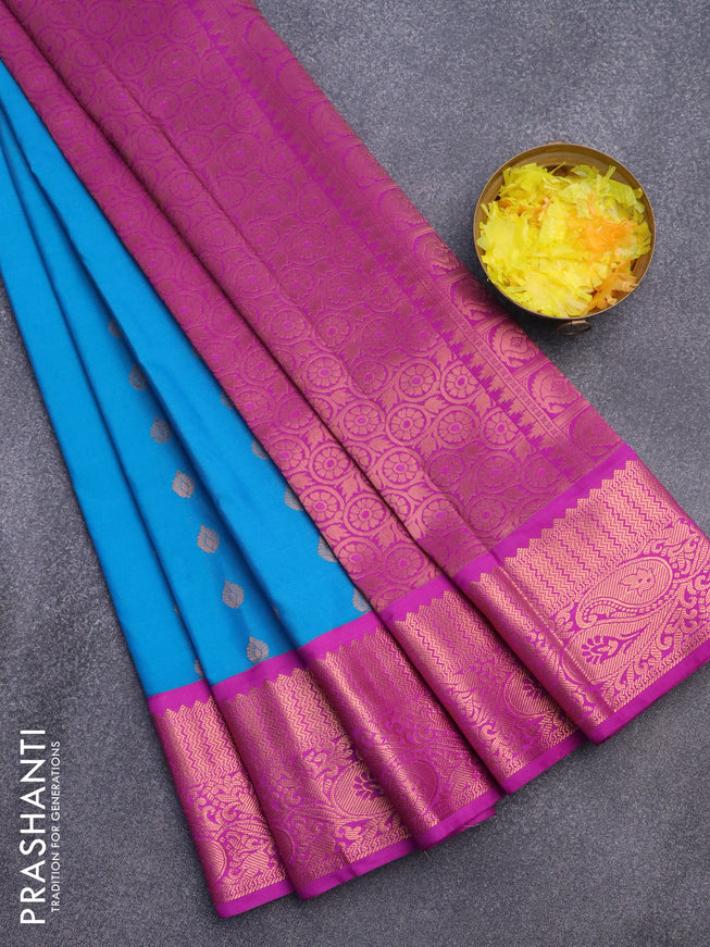 Semi kanjivaram silk saree blue and purple with allover copper zari woven buttas and zari woven korvai border