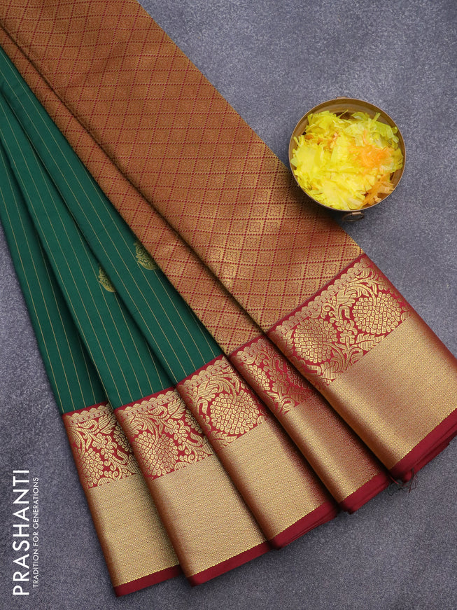 Semi kanjivaram silk saree dark green and maroon with allover zari weaves & buttas and zari woven korvai border