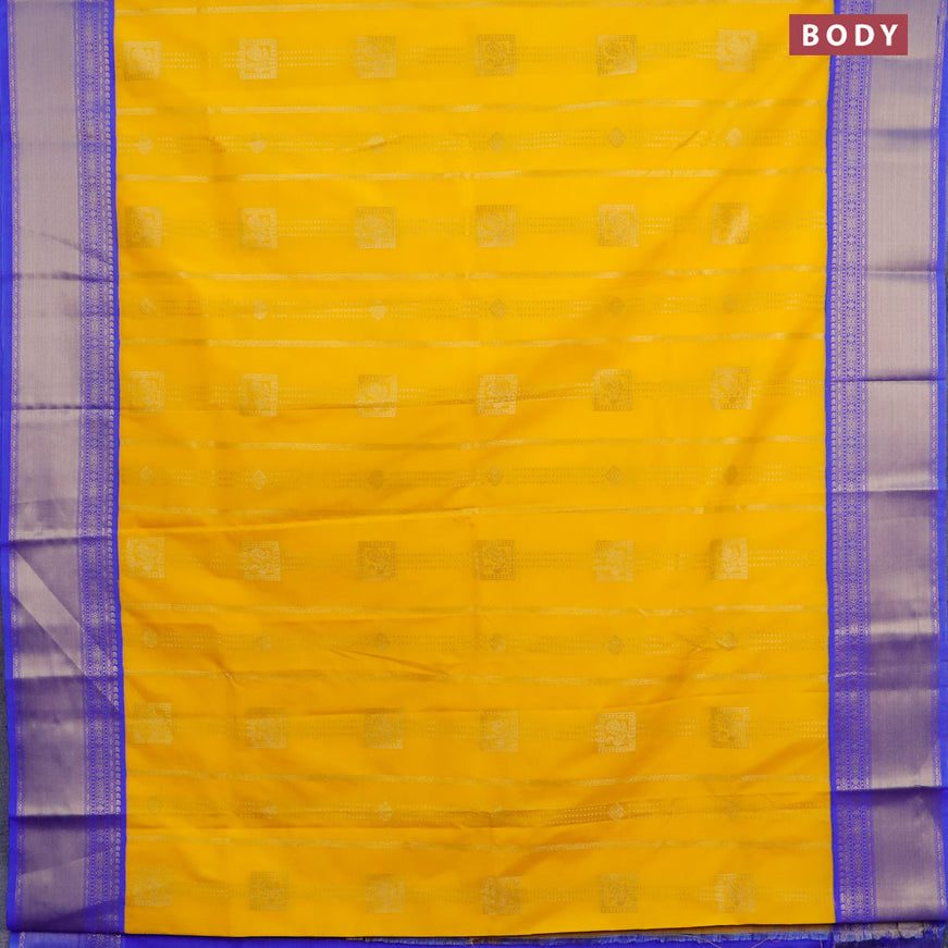 Semi kanjivaram silk saree mango yellow and blue with allover zari weaves and zari woven korvai border
