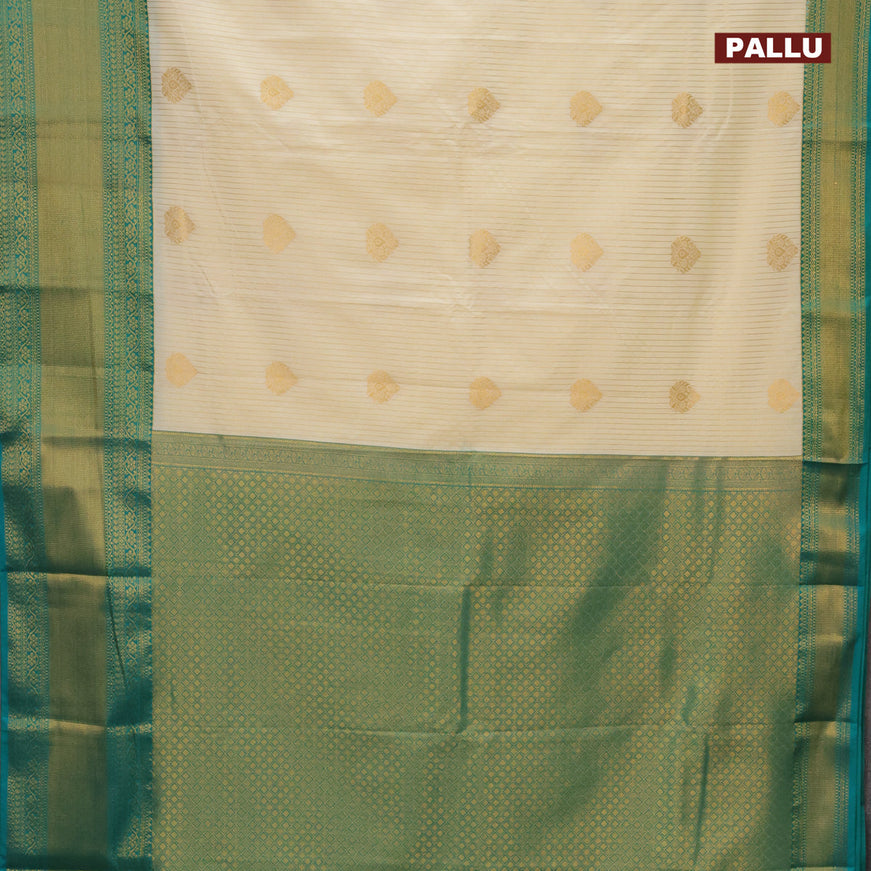 Semi kanjivaram silk saree cream and teal green with allover zari weaves & buttas and long zari woven korvai border