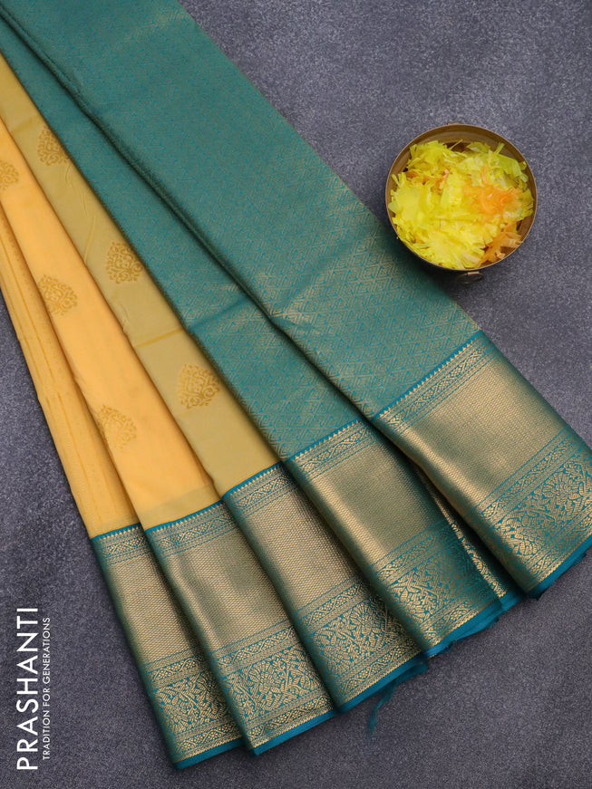 Semi kanjivaram silk saree mango yellow and teal green with allover zari weaves & buttas and long zari woven korvai border