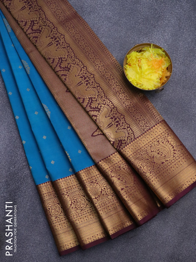Semi kanjivaram silk saree dual shade of blue and wine shade with zari woven buttas and long zari woven korvai border