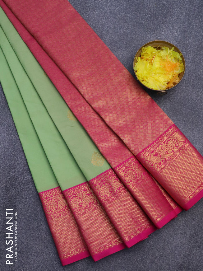 Semi kanjivaram silk saree pista green and pink with zari woven buttas and zari woven korvai border