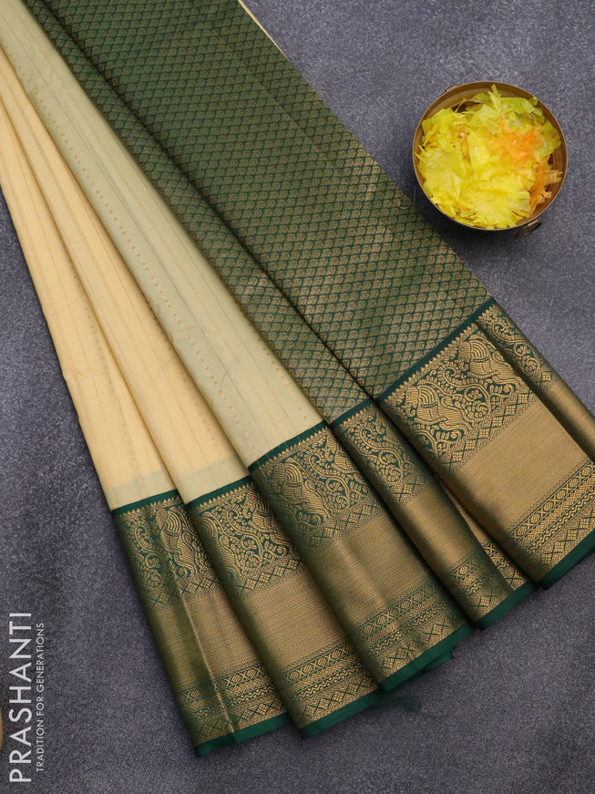 Semi kanjivaram silk saree sandal and green with allover zari weaves and zari woven korvai border