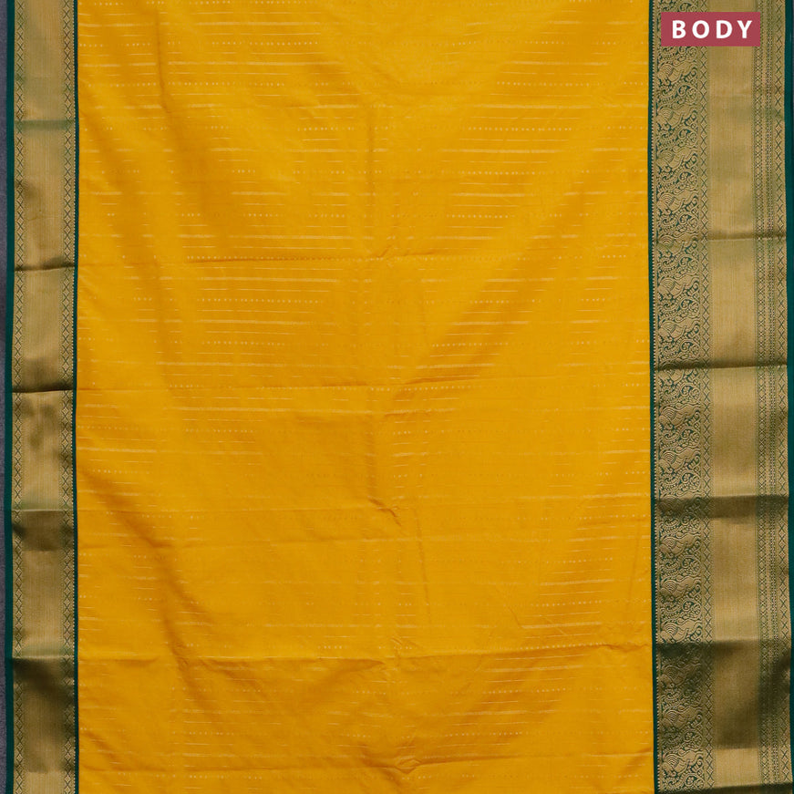 Semi kanjivaram silk saree mustard yellow and green with allover zari weaves and zari woven korvai border