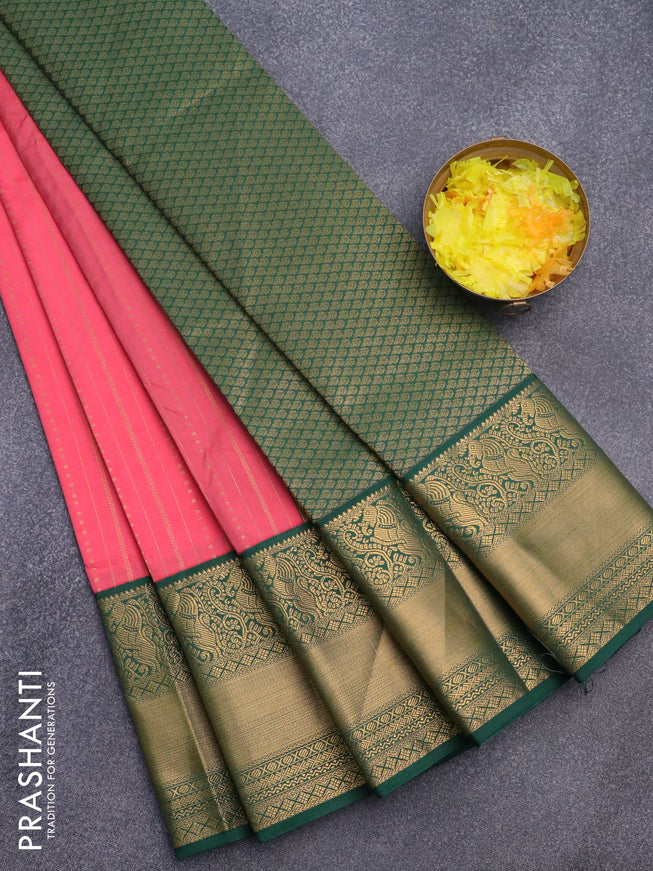 Semi kanjivaram silk saree peach orange and green with allover zari weaves and long zari woven korvai border