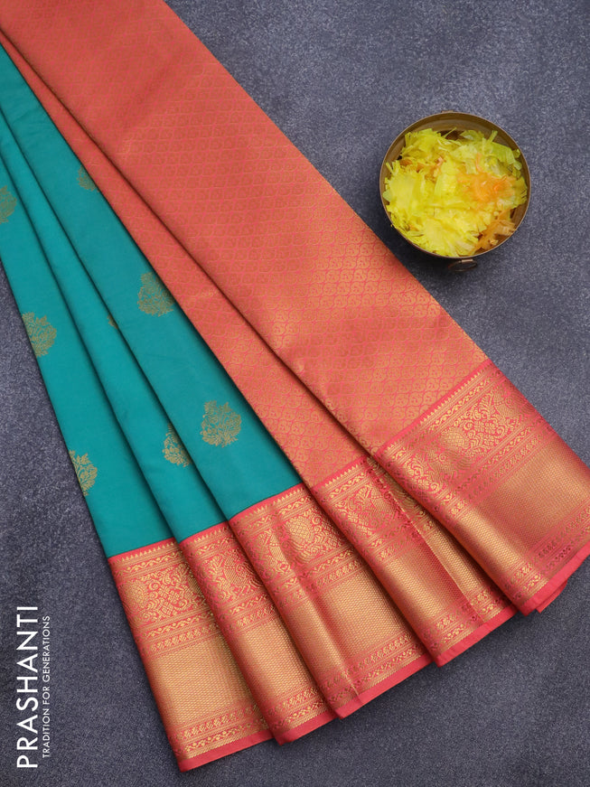 Semi kanjivaram silk saree teal blue shade and peach shade with zari woven buttas and long zari woven korvai border