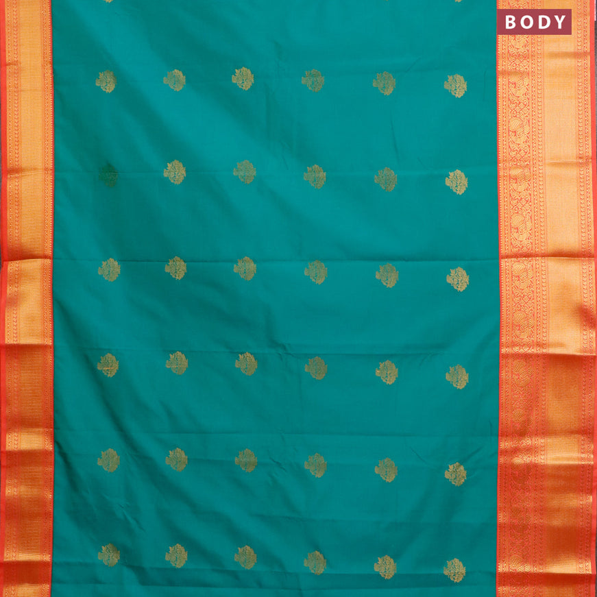 Semi kanjivaram silk saree teal blue shade and peach shade with zari woven buttas and long zari woven korvai border