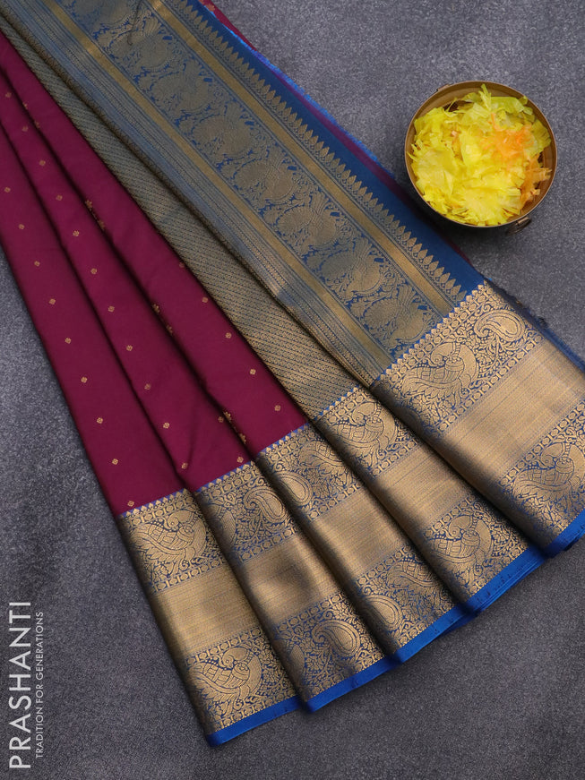 Semi kanjivaram silk saree purple and cs blue with zari woven floral buttas and long zari woven korvai border