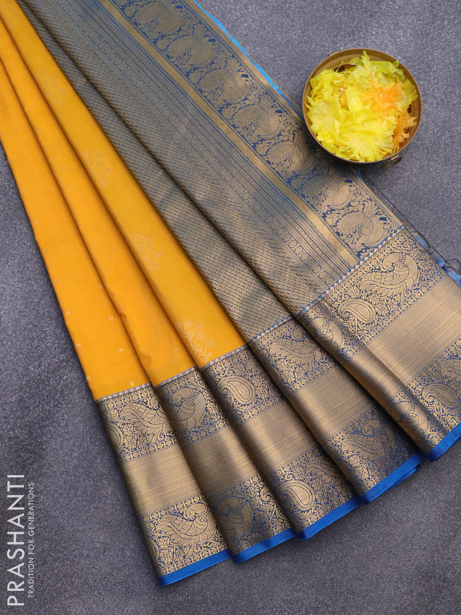 Semi kanjivaram silk saree mango yellow and cs blue with zari woven floral buttas and long zari woven korvai border
