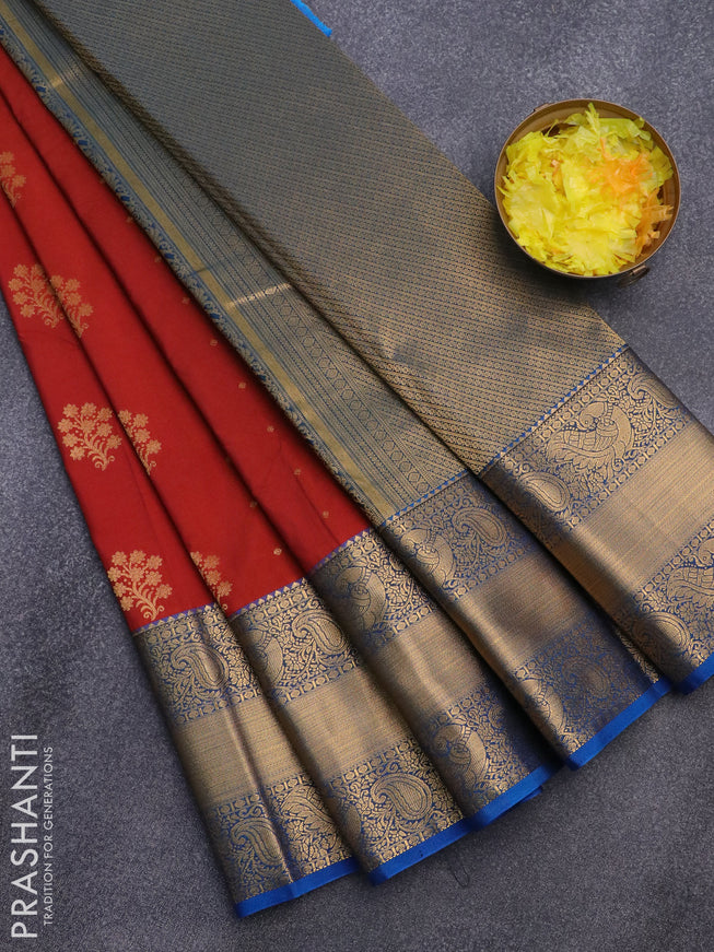 Semi kanjivaram silk saree rust shade and cs blue with zari woven floral buttas and long zari woven korvai border