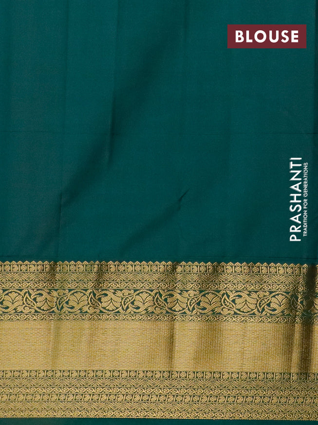 Semi kanjivaram silk saree light pink and dark green with allover zari weaves and long zari woven korvai border